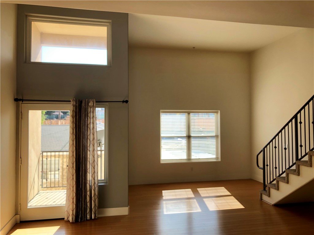 255 West 7th Street, Unit 20 San Pedro, CA 90731 - Photo 6 of 13 a view of an empty room and window