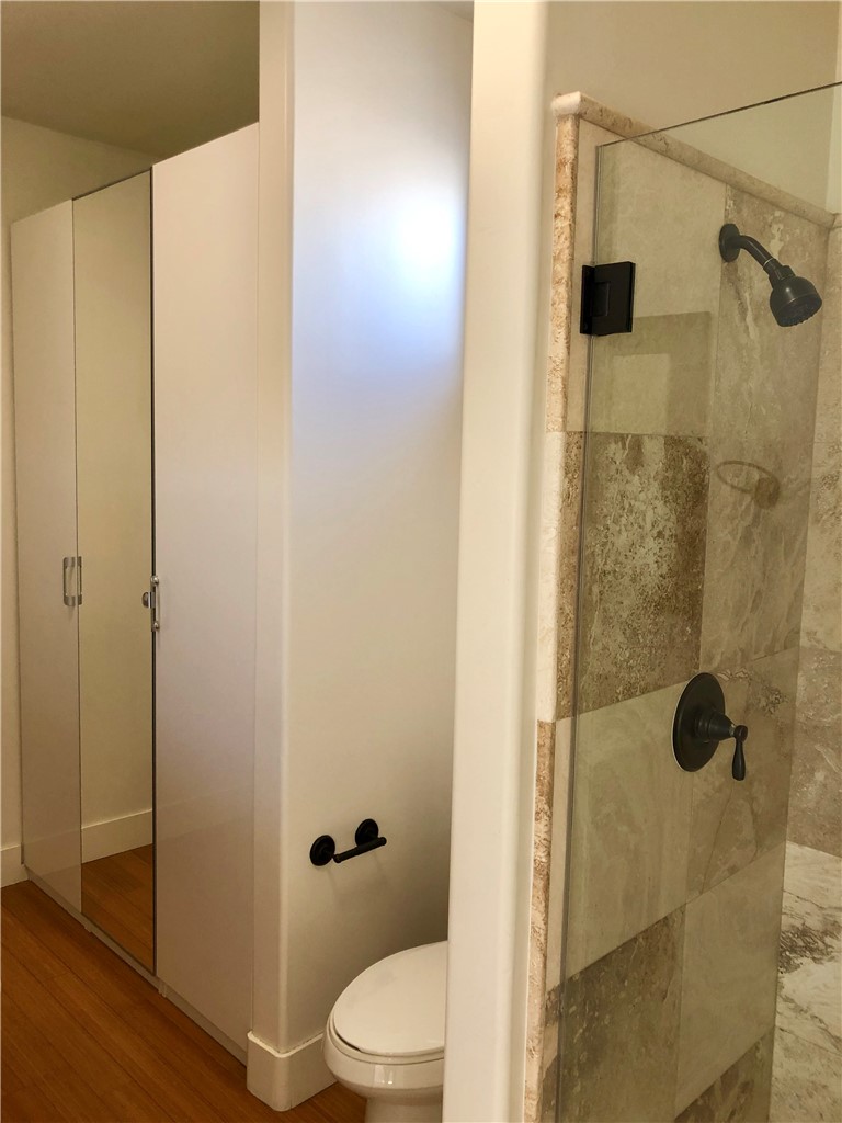 255 West 7th Street, Unit 20 San Pedro, CA 90731 - Photo 10 of 13 a bathroom with a shower and a toilet