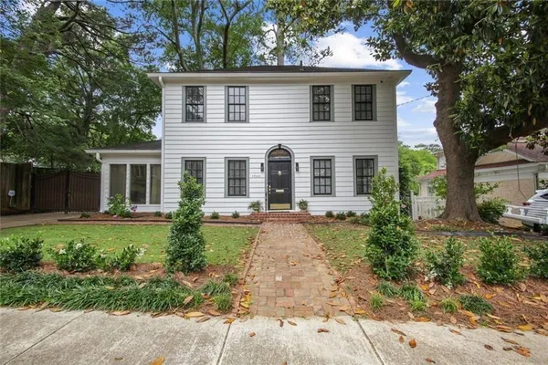 front view of a house with a yard