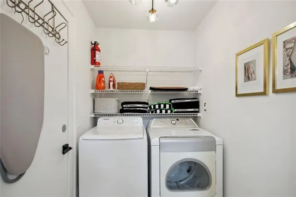 a view of a balcony with wooden floor and outdoor seating