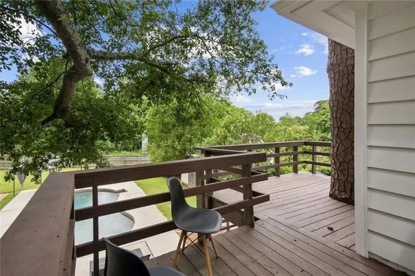 a view of a chairs and table in the patio