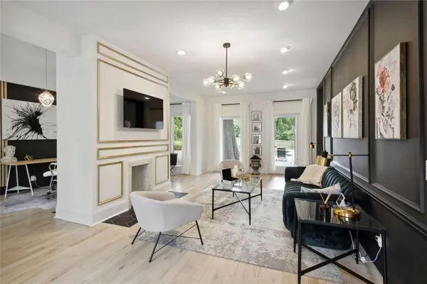 a living room with furniture a fireplace and a flat screen tv