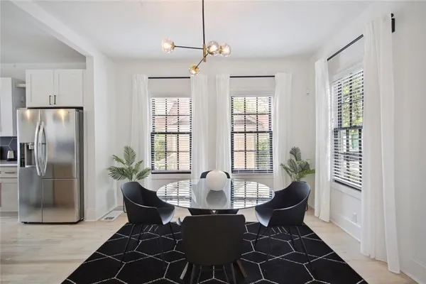 a view of a dining room with furniture window and outside view