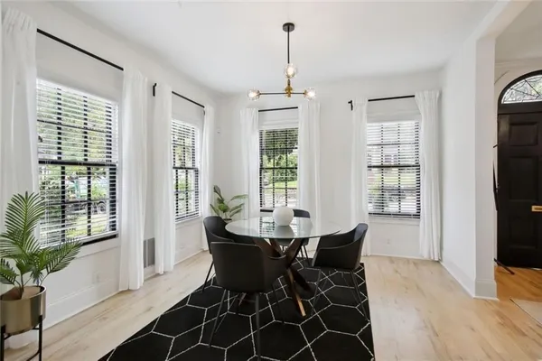 a dining room with furniture window wooden floor