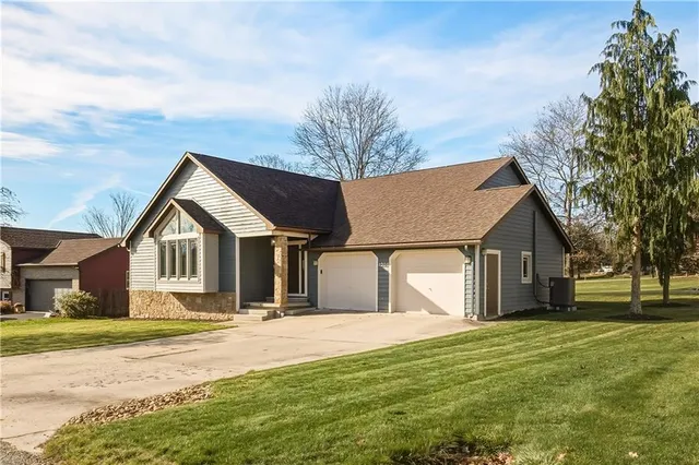 a front view of a house with a yard