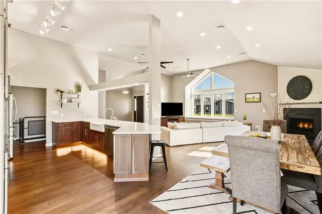 a living room with fireplace furniture and a table