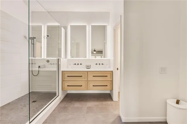 a bathroom with a shower and a sink