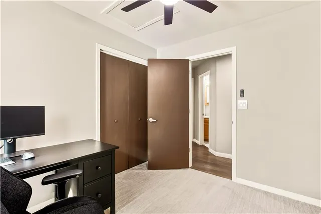 a bedroom with a workspace