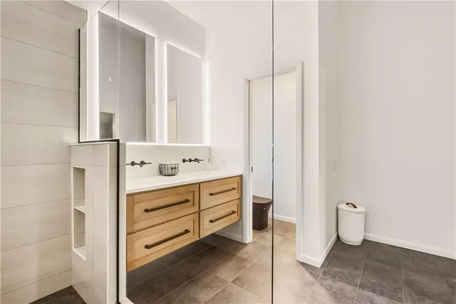a bathroom with a sink and a mirror