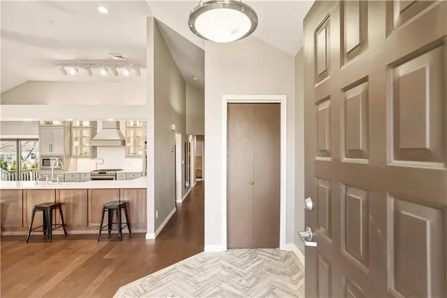 a view of a bedroom with furniture and window