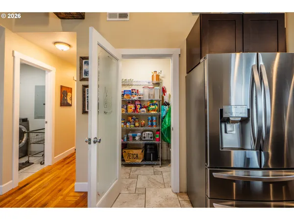 a kitchen with refrigerator and car