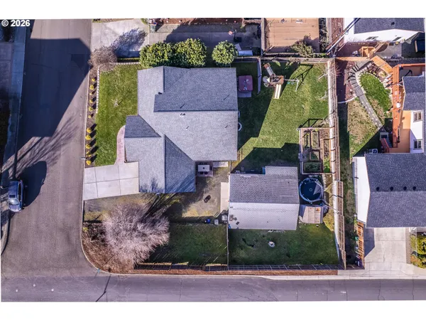 an aerial view of houses with yard