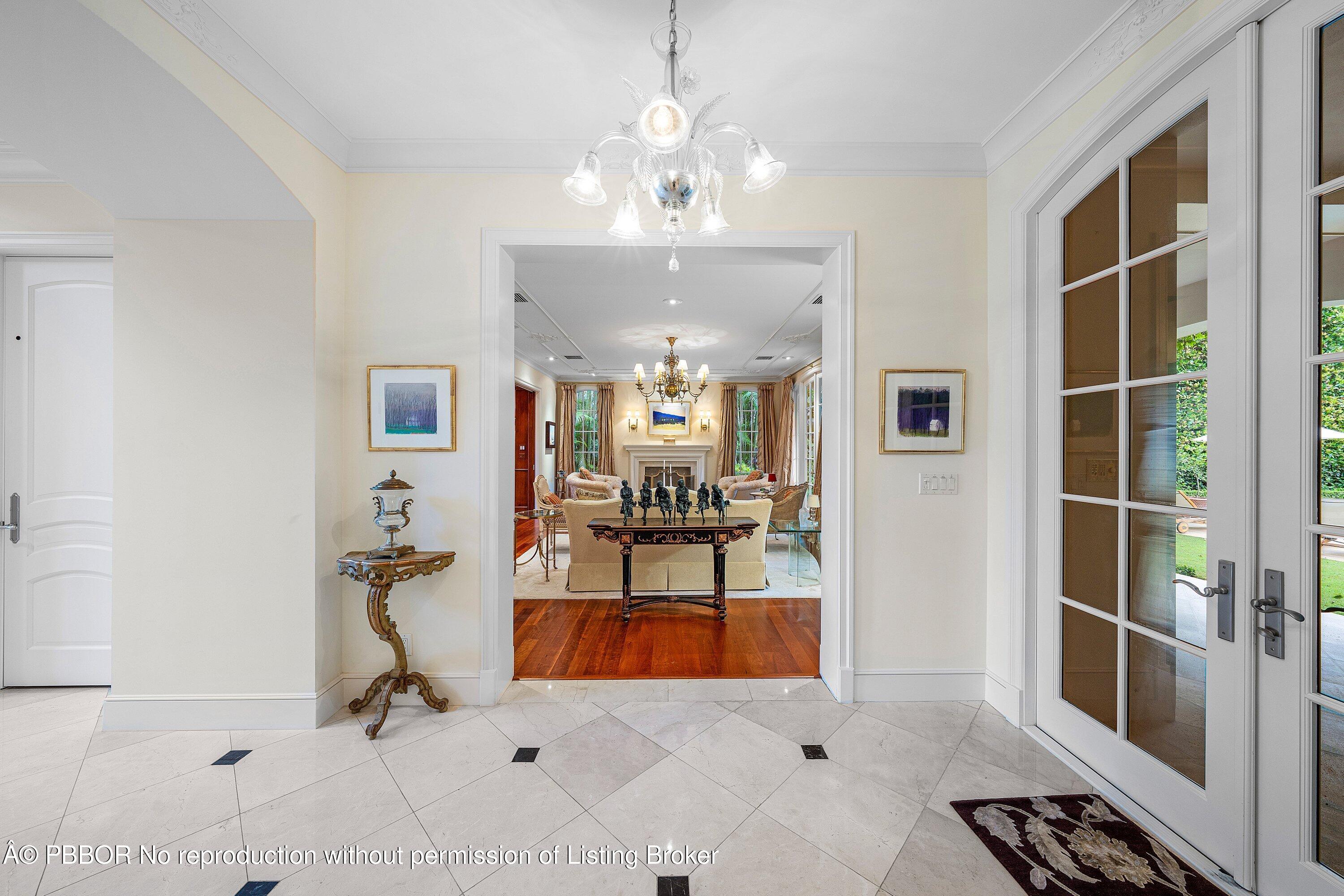 242 Wells Road Palm Beach, FL 33480 - Photo 12 of 54 a view of living room kitchen and entryway