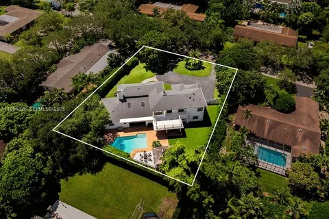 an aerial view of house with a yard