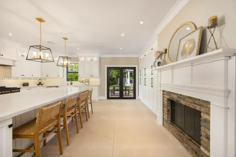 a view of a kitchen with furniture and a fireplace