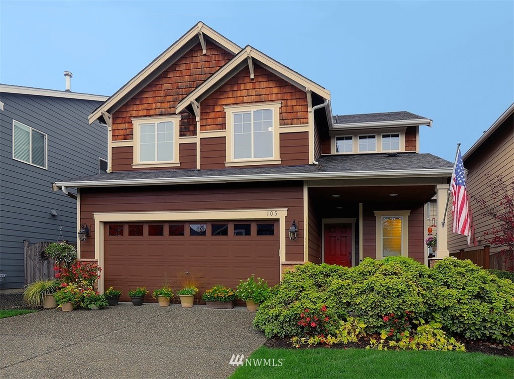 105 196th Place Southwest Bothell, WA 98012 - Photo 1 of 18 a front view of a house with garden