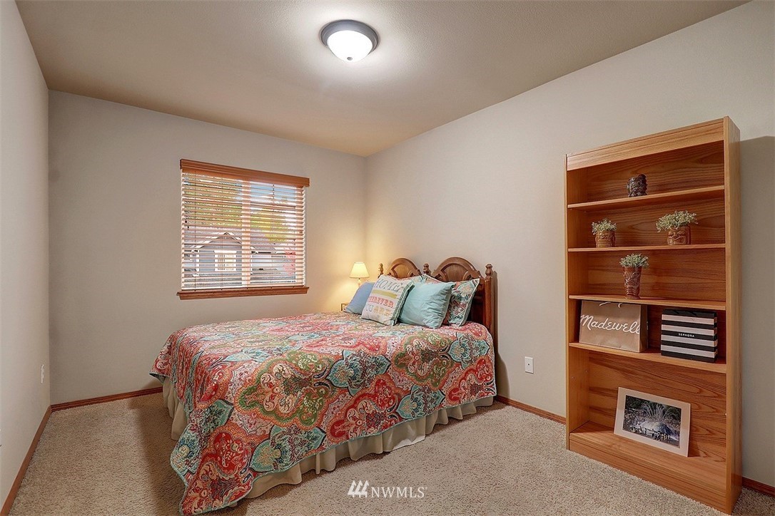 105 196th Place Southwest Bothell, WA 98012 - Photo 11 of 18 a bedroom with a bed and a window