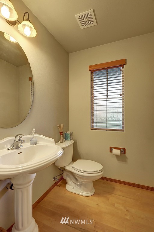 105 196th Place Southwest Bothell, WA 98012 - Photo 14 of 18 a bathroom with a sink a toilet and mirror