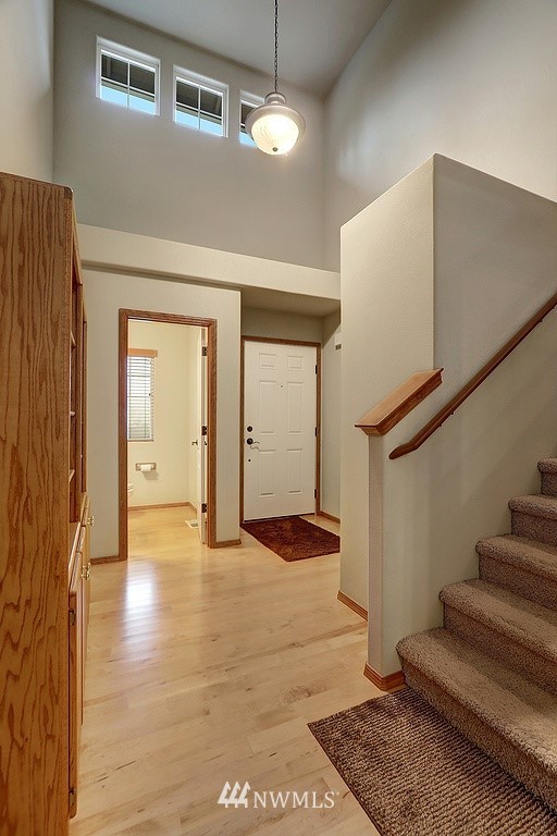 105 196th Place Southwest Bothell, WA 98012 - Photo 15 of 18 a view of an empty room with stairs and a ceiling fan
