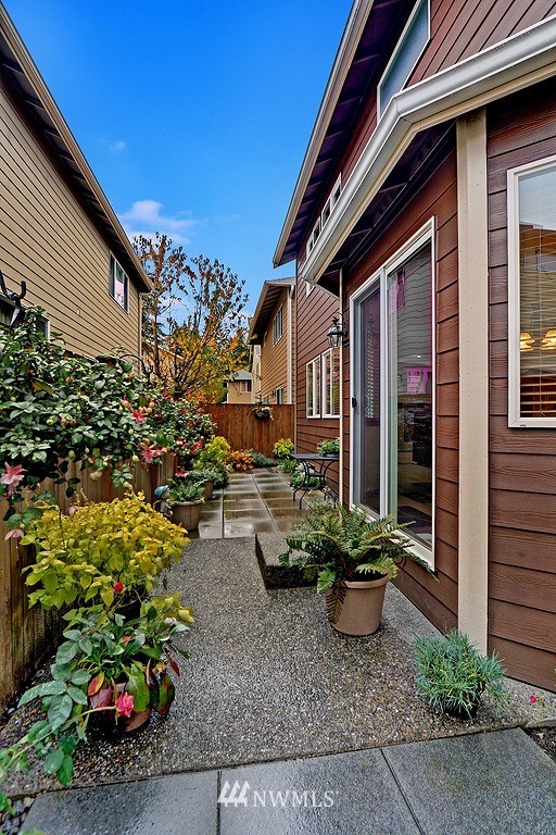 105 196th Place Southwest Bothell, WA 98012 - Photo 16 of 18 a view of a house with a flower garden