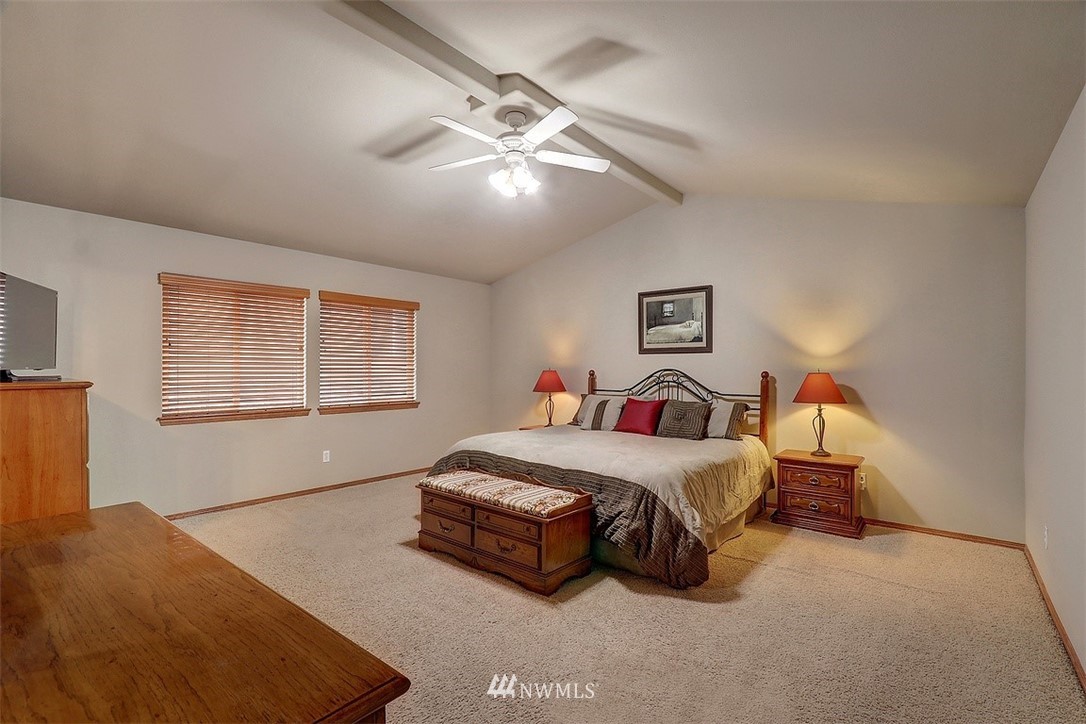 105 196th Place Southwest Bothell, WA 98012 - Photo 9 of 18 a spacious bedroom with a bed and a window