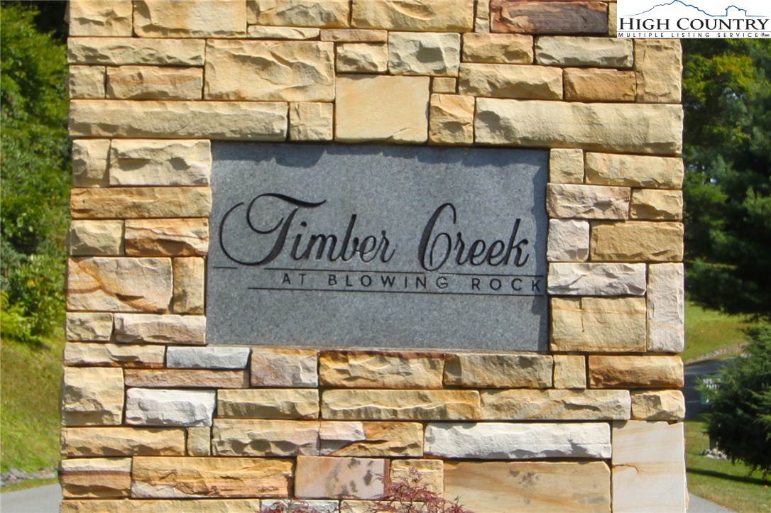 Lot 137 East Indrio Road Blowing Rock, NC 28605 - Photo 25 of 25 a building with a sign on it