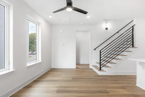 a view of balcony with wooden floor