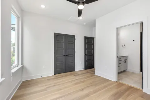 a bathroom with a double vanity sink mirror and shower