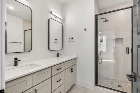 a bathroom with a glass shower door