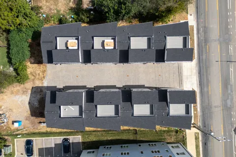 a view of a balcony with wooden floor