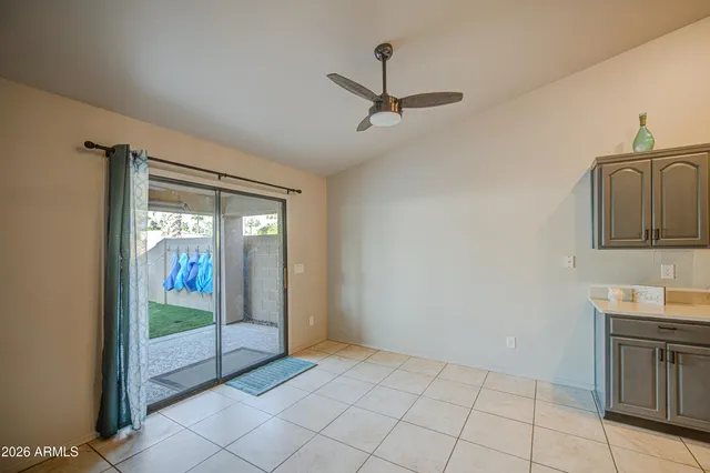 a view of a hallway to an entryway with chandelier
