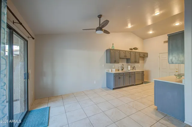 a spacious bathroom with a double vanity sink a mirror and a bathtub