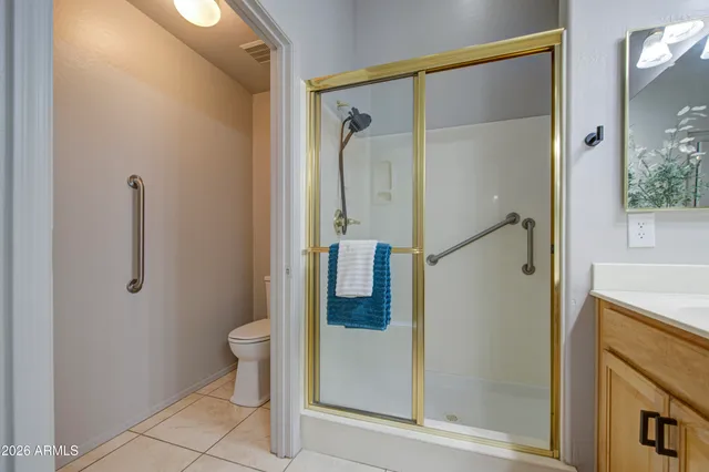a bathroom with a shower and toilet