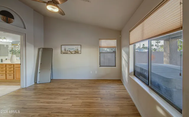 a view of an empty room with a window