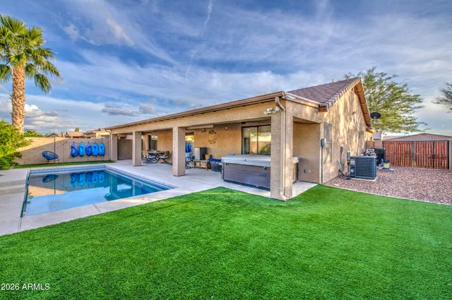 a view of an house with backyard porch and furniture