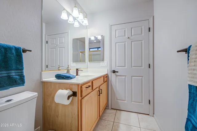 a bathroom with a double vanity sink and mirror