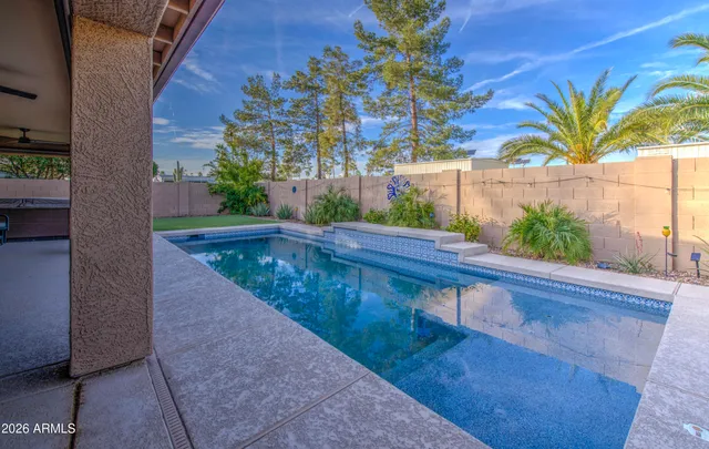 a view of swimming pool with outdoor seating