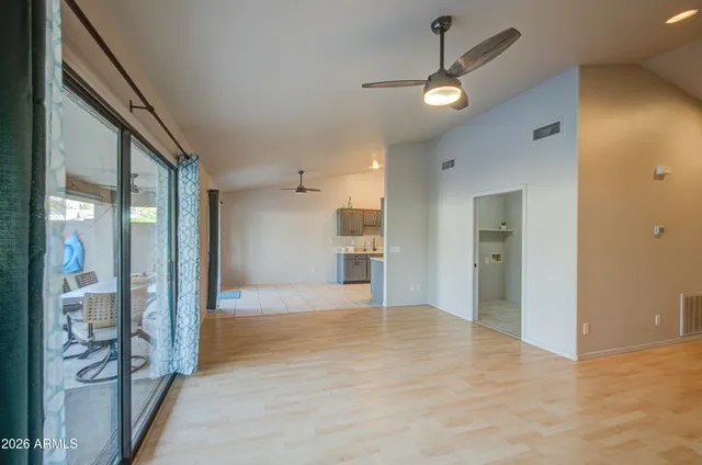 a view of a hallway with wooden shelves