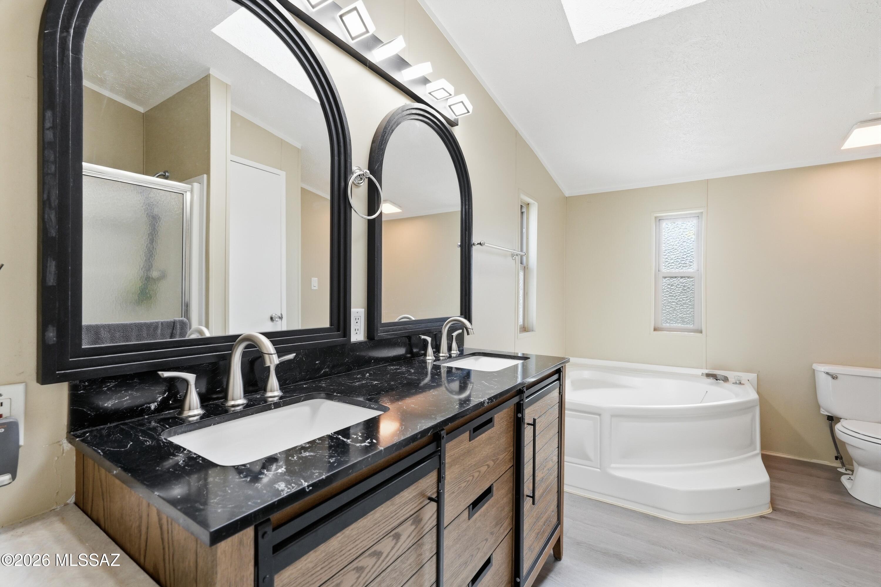 15680 East Colossal Cave Road Vail, AZ 85641 - Photo 21 of 51 Updated floors, vanity, mirrors, lights and faucets.