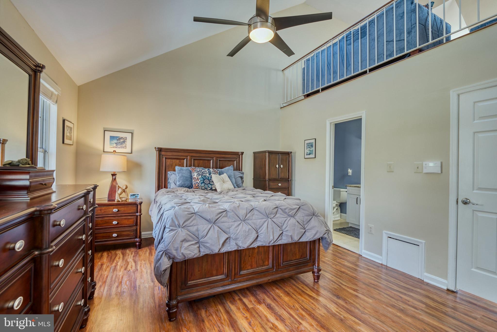2041 Lyttonsville Road Silver Spring, MD 20910 - Photo 15 of 42 a bedroom with a bed and wooden floor