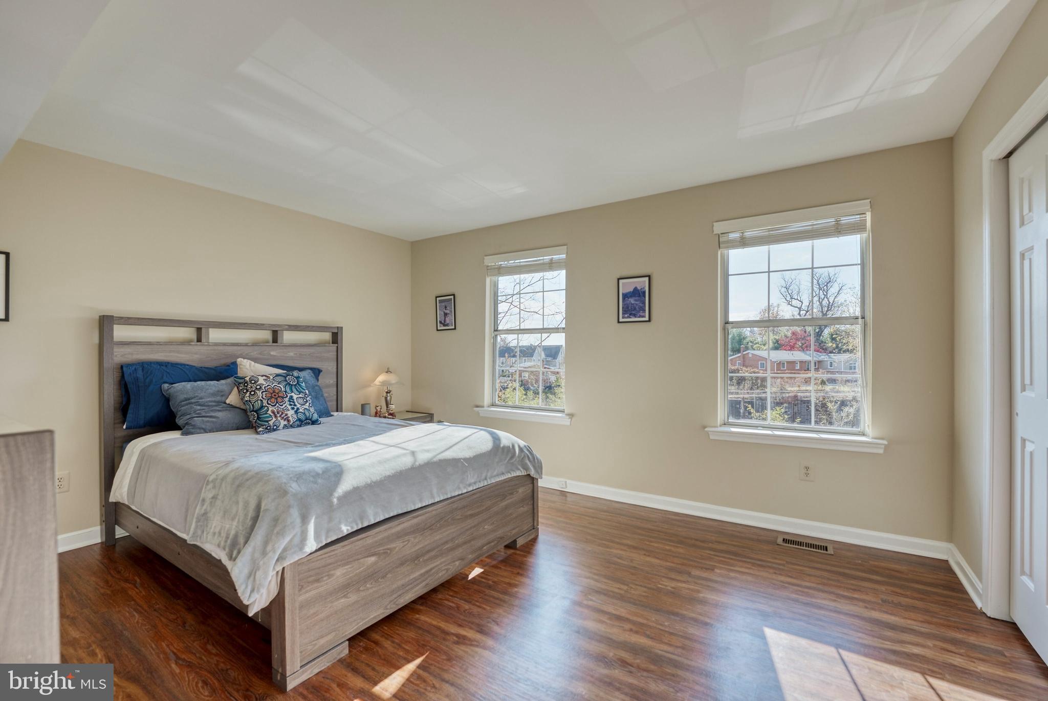 2041 Lyttonsville Road Silver Spring, MD 20910 - Photo 20 of 42 a bedroom with a bed lamp closet and window