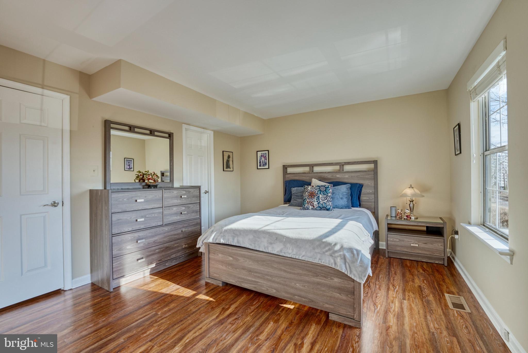 2041 Lyttonsville Road Silver Spring, MD 20910 - Photo 21 of 42 a bedroom with a bed and wooden floor