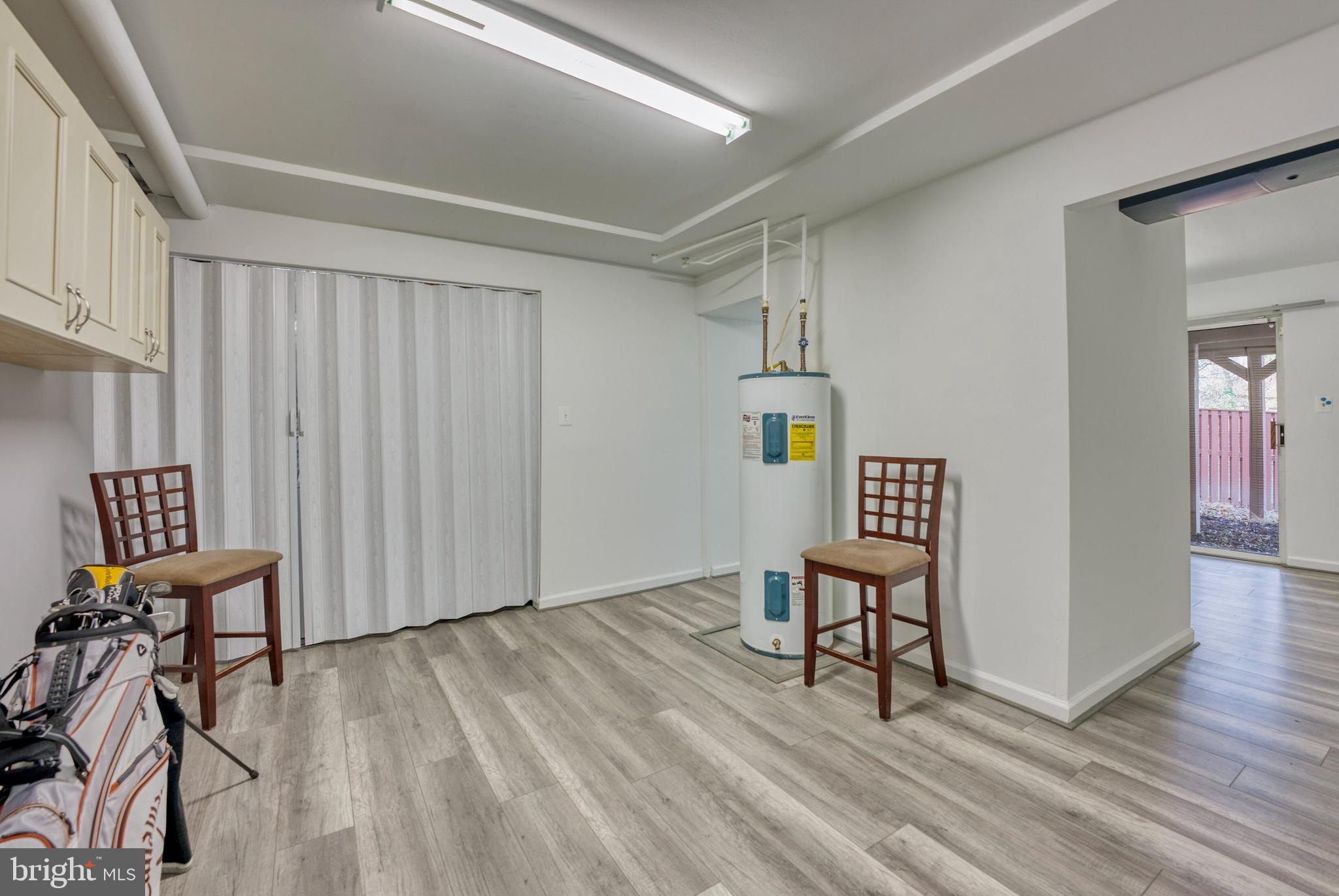 2041 Lyttonsville Road Silver Spring, MD 20910 - Photo 24 of 42 a view of a hallway with wooden floor and furniture