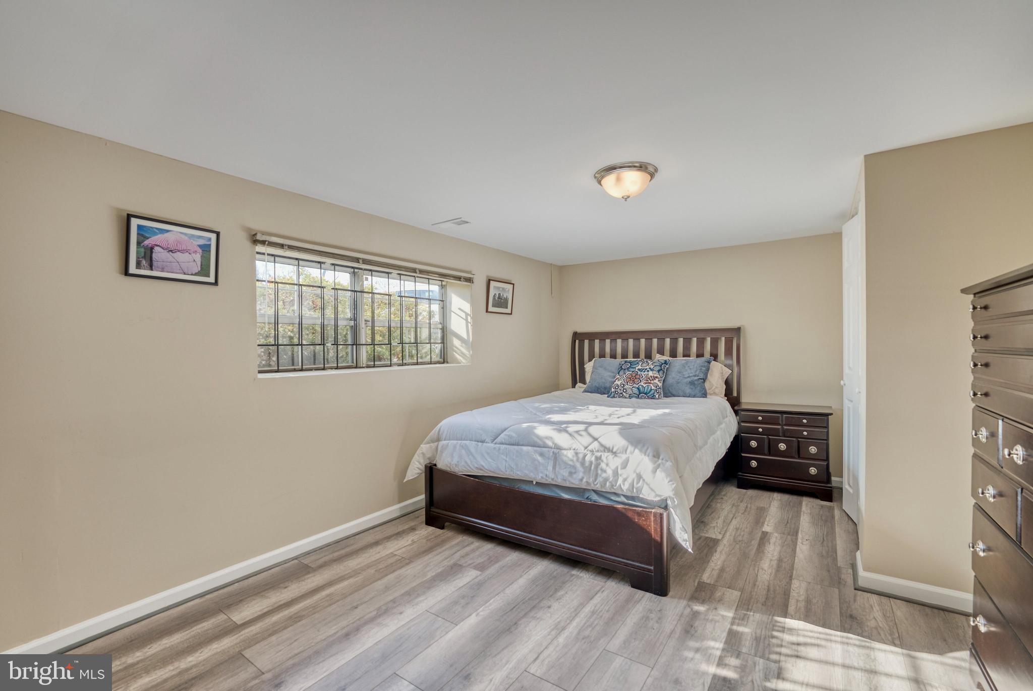 2041 Lyttonsville Road Silver Spring, MD 20910 - Photo 25 of 42 a bedroom with a bed and a window
