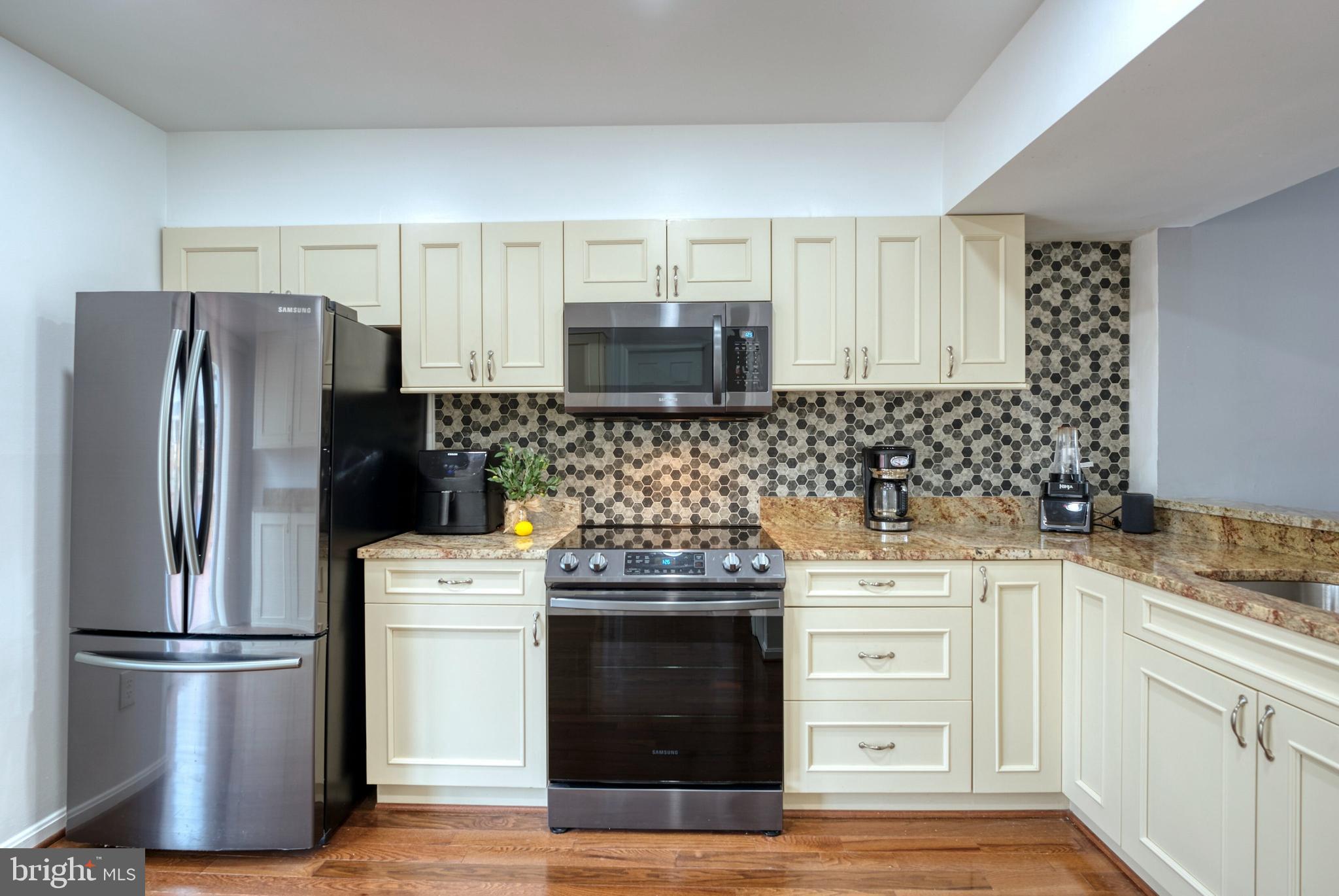 2041 Lyttonsville Road Silver Spring, MD 20910 - Photo 6 of 42 a kitchen with a stove sink and refrigerator