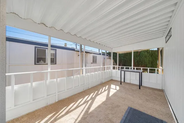 a view of an empty room with windows