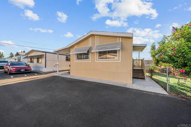 a view of a house with a street