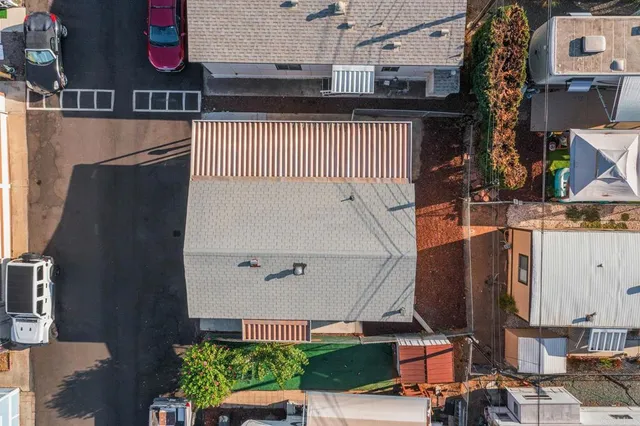 an aerial view of residential houses with outdoor space