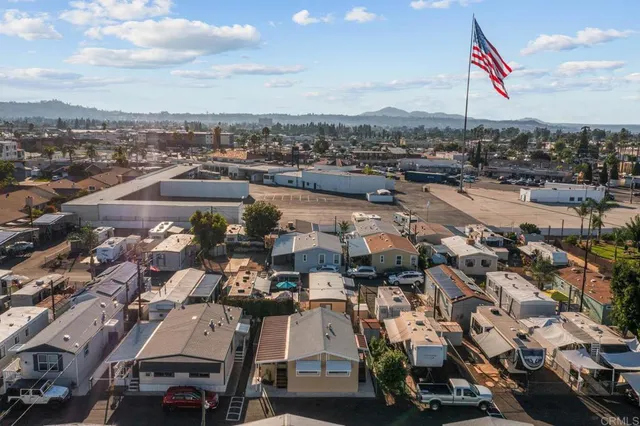 an aerial view of a building with lake view