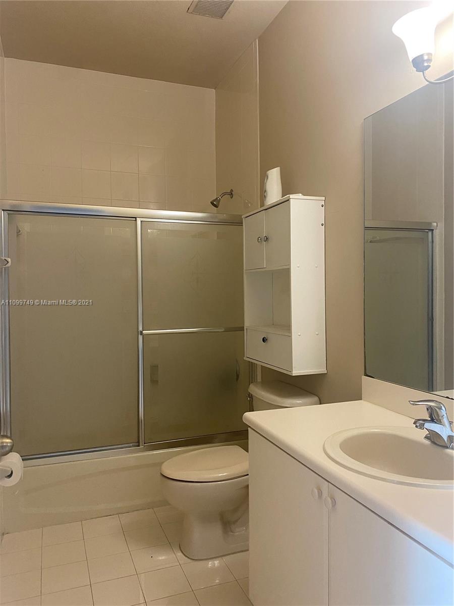 Hialeah Hialeah, FL 33018 - Photo 18 of 27 a bathroom with a granite countertop sink toilet and shower